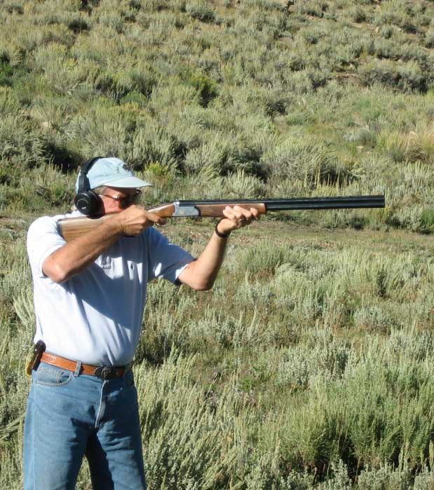 man at shooting range with rifle